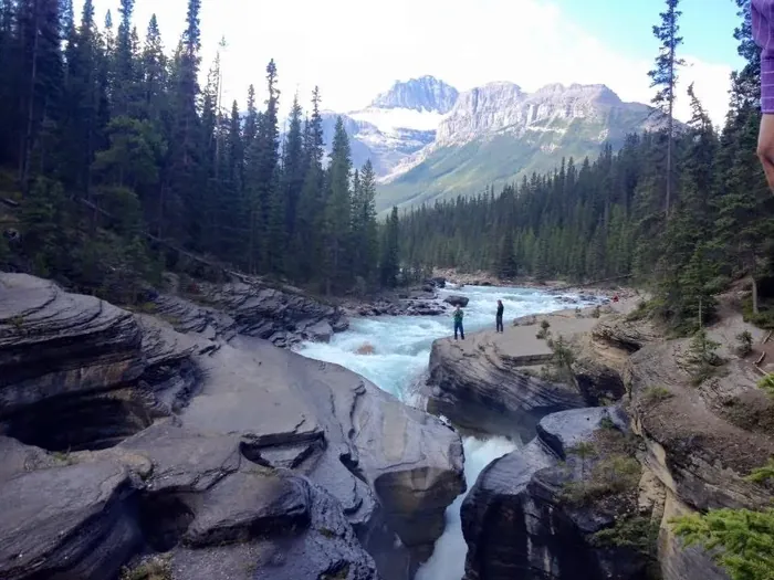 A river running through a rocky canyon in the mountains